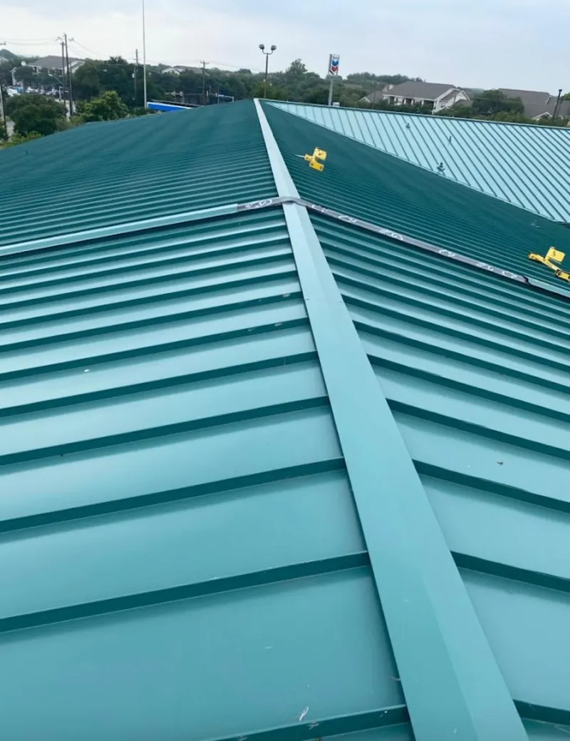 Green commercial metal roof ridge and valley for Metal Roof Repair in Robbinsdale
